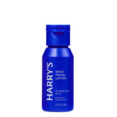 A blue bottle of Harry's Daily Facial Lotion SPF 15, featuring a matching blue flip-top cap, set against a plain white background.